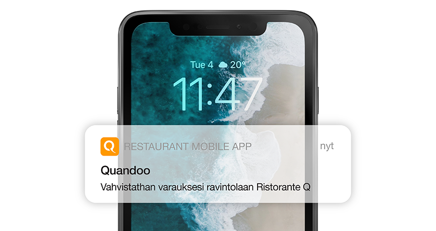Älypuhelin sekä Quandoo-appin push-ilmoitus, jossa lukee ‘Vahvistathan varauksesi ravintolaan Ristorante Q’