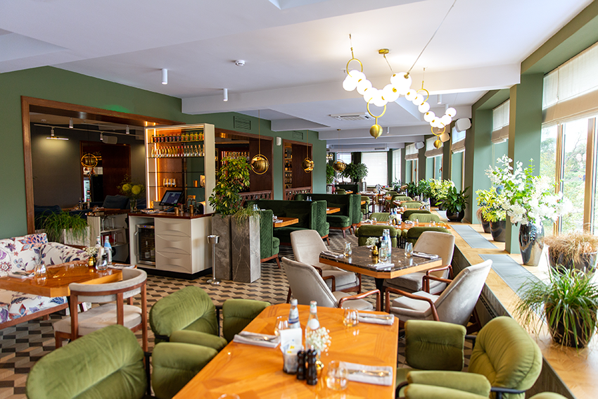 Image of restaurant interior with green decorations